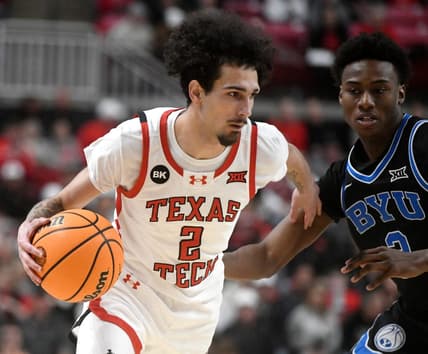 Texas Tech's guard Pop Isaacs (2) dribbles the ball against BYU in a Big 12 basketball game, Saturday, Jan. 20, 2024, at United Supermarkets Arena.