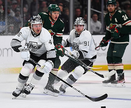 Dec 11, 2021; Los Angeles, California, USA;  Los Angeles Kings left wing Brendan Lemieux (48) and Minnesota Wild left wing Kirill Kaprizov (97) chase down the puck in the third period of the game at Staples Center. Mandatory Credit: Jayne Kamin-Oncea-USA TODAY Sports