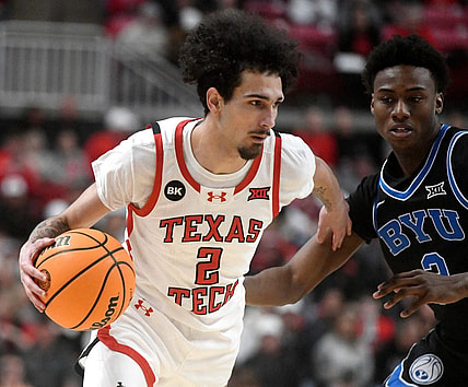 Texas Tech's guard Pop Isaacs (2) dribbles the ball against BYU in a Big 12 basketball game, Saturday, Jan. 20, 2024, at United Supermarkets Arena.