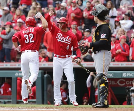Apr 2, 2023; Cincinnati, Ohio, USA; Cincinnati Reds first  baseman Jason Vosler (32) reacts with designated hitter Wil Myers (4) after hitting a solo home run against the Pittsburgh Pirates during the second inning at Great American Ball Park. Mandatory Credit: David Kohl-USA TODAY Sports