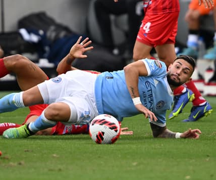 Feb 23, 2022; Los Angeles, CA, USA; New York City midfielder Valentin Castellanos (11) and Santos de Guapiles defender Everardo Rubio (21) battle for the ball in the second half at Banc of California Stadium. Mandatory Credit: Jayne Kamin-Oncea-USA TODAY Sports