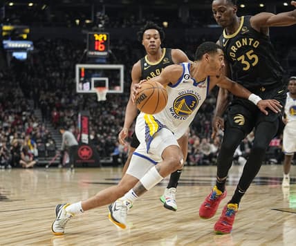 Dec 18, 2022; Toronto, Ontario, CAN; Golden State Warriors guard Jordan Poole (3) drives to the net against Toronto Raptors forward Christian Koloko (35) during the first half at Scotiabank Arena. Mandatory Credit: John E. Sokolowski-USA TODAY Sports