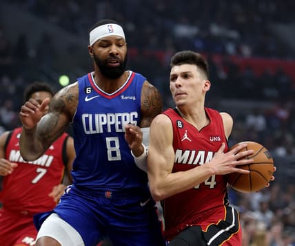 Jan 2, 2023; Los Angeles, California, USA;  Miami Heat guard Tyler Herro (14) drives to the basket against Los Angeles Clippers forward Marcus Morris Sr. (8) during the first quarter at Crypto.com Arena. Mandatory Credit: Kiyoshi Mio-USA TODAY Sports