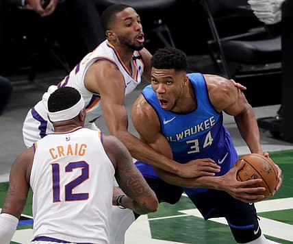 Suns forward Mikal Bridges fouls Bucks forward Giannis Antetokounmpo (34) during their game Monday, April 19, 2021 at Fiserv Forum.

Mjs Bucks20 12 Jpg Bucks20