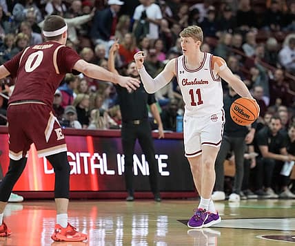 Jan 14, 2023; Charleston, South Carolina, USA; Charleston Cougars guard Ryan Larson (11) directs traffic in the first half against the Elon Phoenix at TD Arena. Mandatory Credit: David Yeazell-USA TODAY Sports