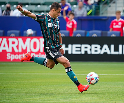 Apr 25, 2021; Carson, California, USA; Los Angeles Galaxy forward Javier Hernandez (14) shoots and scores his second goal of the first half against the New York Red Bulls at Dignity Health Sports Park. Mandatory Credit: Robert Hanashiro-USA TODAY Sports