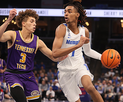 Memphis Tigers guard Emoni Bates drives past Tennessee Tech Golden Eagles guard Keishawn Davidson during their game at FedExForum on Tuesday, Nov. 9, 2021.

Jrca9418