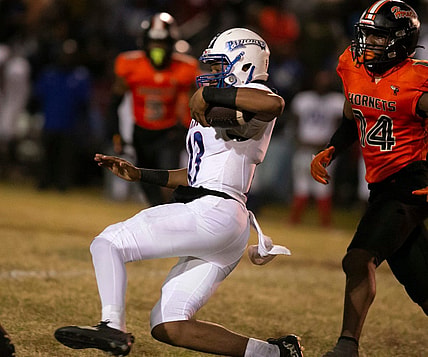 Pahokee quarterback Austin Simmons (13) slides into a first down during first half action on  Friday, Nov. 25, 2022, at Hawthorne High School in Hawthorne, Fla. during the 2022 FHSAA Football State Championships play off.  Hawthorne held on to win 21-20.  [Alan Youngblood/Gainesville Sun]

Flgai 112722 Pahokee Hawthorne 03583060