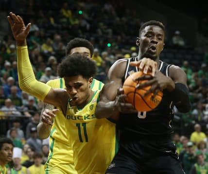 Oregon's Rivaldo Soares, left, battles Central Florida's Lahat Thioune ifor a rebound during their NIT game in Eugene.

Ncaa Basketball Oregon Ucf In The Nit Ucf At Oregon