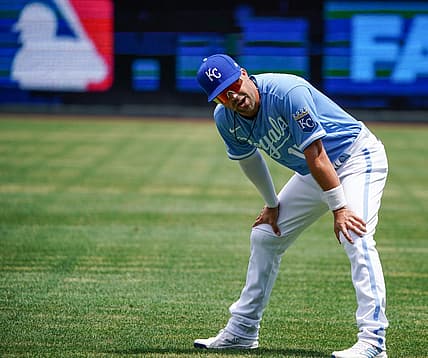 Jul 24, 2022; Kansas City, Missouri, USA; Kansas City Royals second baseman Whit Merrifield (15) stretches prior to the game against the Tampa Bay Rays at Kauffman Stadium. Mandatory Credit: Denny Medley-USA TODAY Sports