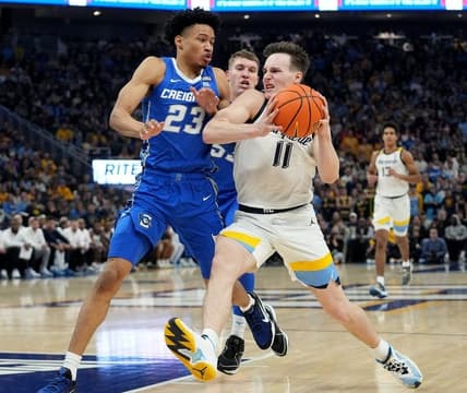 Marquette guard Tyler Kolek drives past Creighton guard Trey Alexander during the first half at Fiserv Forum.Mark Hoffman/Milwaukee Journal Sentinel