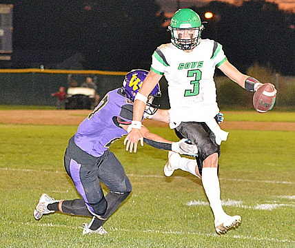 Pierre's Lincoln Kienholz scrambles against Watertown's Spencer Wientjes during their Eastern South Dakota Conference football game on Friday, Sept. 23, 2022 at Watertown Stadium. Pierre won 47-13.