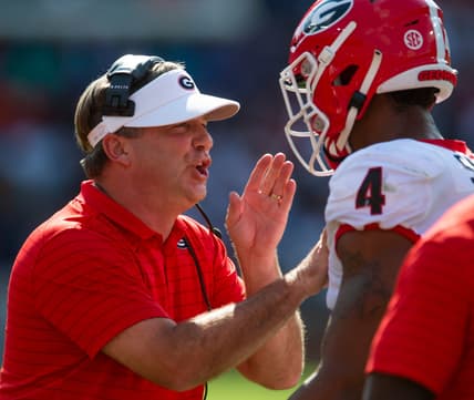 Georgia Bulldog head coach Kirby Smart works with outside linebacker Nolan Smith (4) against the Auburn Tigers at Jordan-Hare Stadium in Auburn, Ala., on Saturday, Oct. 9, 2021.

Auga05