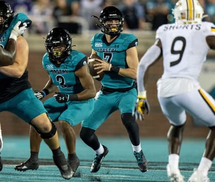 Nov 12, 2022; Conway, South Carolina, USA; Coastal Carolina Chanticleers quarterback Jarrett Guest (7) sets for a pass in the fourth quarter against the Southern Mississippi Golden Eagles at Brooks Stadium. Mandatory Credit: David Yeazell-USA TODAY Sports