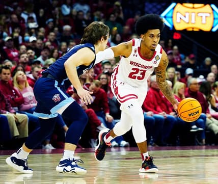 Wisconsin guard Chucky Hepburn (23) drives to the basket as Liberty guard Colin Porter (0) attempts to block him during the second half of their game of the second round of the National Invitation Tournament on Sunday March 19, 2023 at the Kohl Center in Madison, Wis.