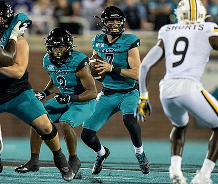Nov 12, 2022; Conway, South Carolina, USA; Coastal Carolina Chanticleers quarterback Jarrett Guest (7) sets for a pass in the fourth quarter against the Southern Mississippi Golden Eagles at Brooks Stadium. Mandatory Credit: David Yeazell-USA TODAY Sports