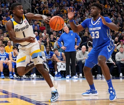 Marquette guard Kam Jones (1) keeps the ball inbounds flinging it past Creighton center Fredrick King (33) during the second half of their game Friday, December 16, 2022 at Fiserv Forum in Milwaukee, Wis. Marquette beat Creighton 69-58.

Mumen16 17