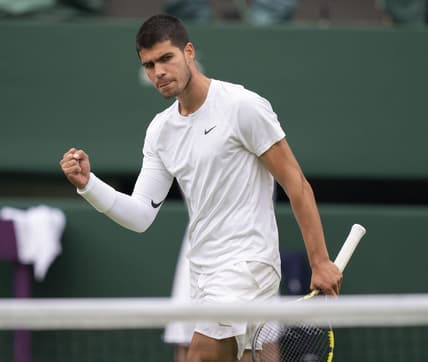 Jul 3, 2022; London, United Kingdom; Carlos Alcaraz (ESP) reacts to a point during his match against Jannik Sinner (ITA) on day seven at All England Lawn Tennis and Croquet Club. Mandatory Credit: Susan Mullane-USA TODAY Sports