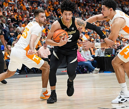 Nov 13, 2022; Nashville, Tennessee, USA;  Colorado Buffaloes guard KJ Simpson (2) and Tennessee Volunteers forward Olivier Nkamhoua (13) and guard Santiago Vescovi (25) during the second hall at Bridgestone Arena. Mandatory Credit: Steve Roberts-USA TODAY Sports