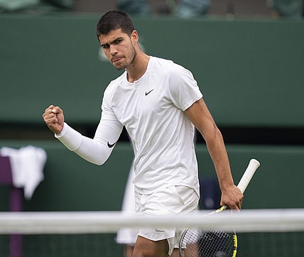 Jul 3, 2022; London, United Kingdom; Carlos Alcaraz (ESP) reacts to a point during his match against Jannik Sinner (ITA) on day seven at All England Lawn Tennis and Croquet Club. Mandatory Credit: Susan Mullane-USA TODAY Sports