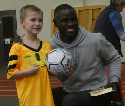 Jonathan Mensah, Columbus Crew defender, takes a photo with a camper on Sunday, Jan. 15, 2023. The Rotary Club of Granville and Denison University hosted a camp to benefit the Royal Seed Orphanage & School in Ofaakor, Ghana, through the Jonathan Mensah Foundation.

NEW denison soccer camp 003