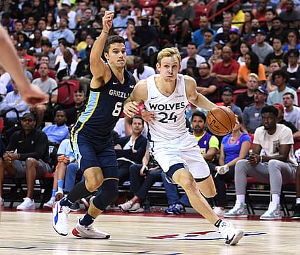 Jul 15, 2019; Las Vegas, NV, USA; Minnesota Timberwolves guard Canyon Barry (24) dribbles the ball against Memphis Grizzlies guard Dusty Hannahs (8) during the second half of the NBA Summer League championship game at Thomas & Mack Center. Mandatory Credit: Stephen R. Sylvanie-USA TODAY Sports