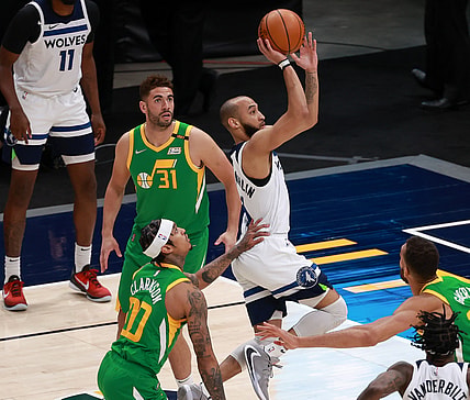 Apr 24, 2021; Salt Lake City, Utah, USA; Minnesota Timberwolves guard Jordan McLaughlin (6) gets past Utah Jazz guard Jordan Clarkson (00) and to the basket during the fourth quarter at Vivint Arena. Minnesota Timberwolves won 101-96. Mandatory Credit: Chris Nicoll-USA TODAY Sports