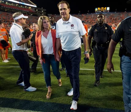 Auburn head coach Gus Malzahn and his wife, Kristi, walk of the field at Jordan-Hare Stadium in Auburn, Ala., on Saturday, Sept. 28, 2019. Auburn defeated Mississippi State 56-23.

Jc Auburnmissstate 73