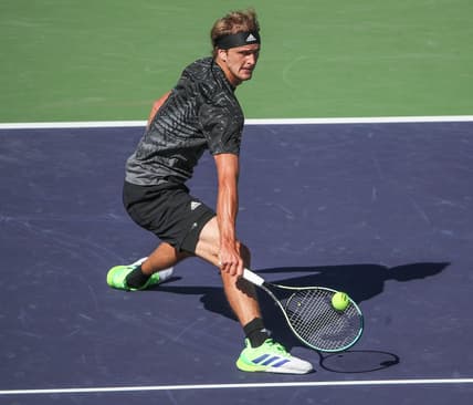 Alexander Zverev reaches for a lob near the net against Taylor Fritz during their quarterfinal match at the BNP Paribas Open in Indian Wells, October 15, 2021.

Bnp Friday 7