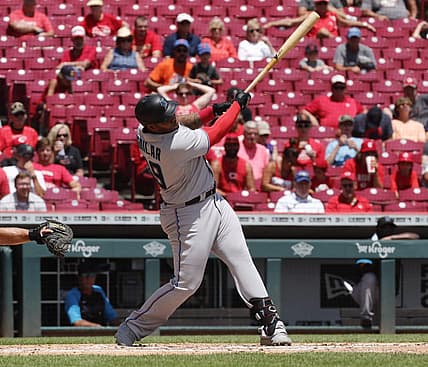 Jul 28, 2022; Cincinnati, Ohio, USA; Miami Marlins designated hitter Jesus Aguilar (99) hits a two-run home run against the Cincinnati Reds during the third inning at Great American Ball Park. Mandatory Credit: David Kohl-USA TODAY Sports