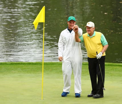 Apr 4, 2018; Augusta, GA, USA; Gary Nicklaus, Jr. the grandson of Jack Nicklaus holds up the ball after making a hole-in-one on the 9th hole during the Par 3 Contest before the Masters golf tournament at Augusta National Golf Club. Mandatory Credit: Rob Schumacher-USA TODAY Sports