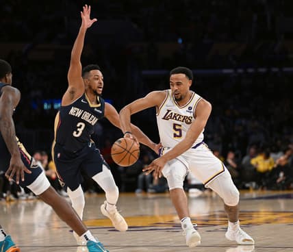 Feb 27, 2022; Los Angeles, California, USA; New Orleans Pelicans guard CJ McCollum (3) defends a pass by Los Angeles Lakers guard Talen Horton-Tucker (5) in the first half at Crypto.com Arena. Mandatory Credit: Jayne Kamin-Oncea-USA TODAY Sports