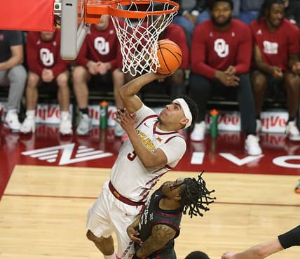 Iowa State Cyclones guard Tamin Lipsey (3) takes a shoot around Oklahoma Sooners guard Rivaldo Soares (5) during the first half in the Big-12 conference showdown at Hilton Coliseum on Wednesday, Feb. 28, 2024, in Ames, Iowa.