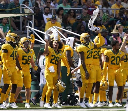 Sep 25, 2021; Waco, Texas, USA; Baylor Bears players wave their towels in the first half of the game against the Iowa State Cyclones at McLane Stadium. Mandatory Credit: Scott Wachter-USA TODAY Sports
