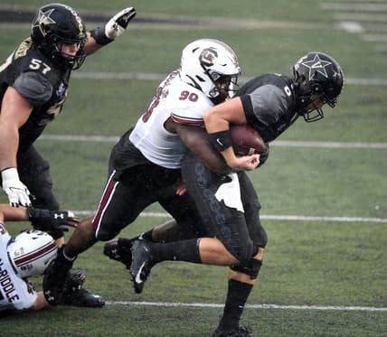 Vanderbilt quarterback Ken Seals (8) is sacked by South Carolina defensive lineman Rick Sandidge (90) during the fourth quarter at Vanderbilt Stadium Saturday, Oct. 10, 2020 in Nashville, Tenn.

Gw43366