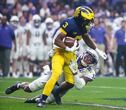 December 31, 2022; Glendale, Ariz; USA; TCU linebacker Dee Winters (13) tackles Michigan wide receiver AJ Henning (3) during the second half at State Farm Stadium. Mandatory Credit: Patrick Breen-Arizona Republic

Ncaa Fiesta Bowl Game