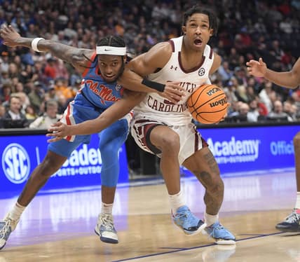 Mar 8, 2023; Nashville, TN, USA;  South Carolina Gamecocks guard Meechie Johnson (5) drives past Mississippi Rebels guard Amaree Abram (1) during the second half at Bridgestone Arena. Mandatory Credit: Steve Roberts-USA TODAY Sports
