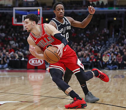 Nov 26, 2018; Chicago, IL, USA; Chicago Bulls guard Zach LaVine (8) drives to the basket past San Antonio Spurs guard DeMar DeRozan (10) during the second half at United Center. Mandatory Credit: Kamil Krzaczynski-USA TODAY Sports