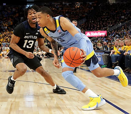 Marquette guard Greg Elliott (5) turns the corner on Butler guard Jayden Taylor (13) during the first half of their game Saturday, February 26, 2022 at Fiserv Forum in Milwaukee, Wis.

Mumen27 2