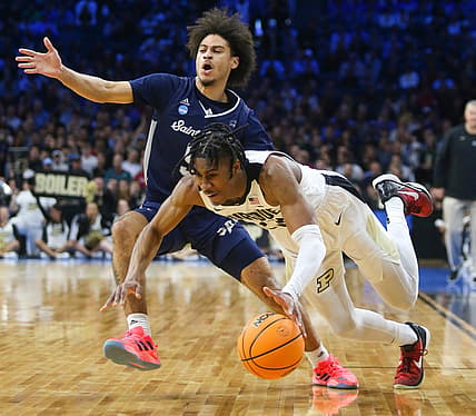 Saint Peter's Daryle Banks III defends against Purdue's Jaden Ivey in the first half in the Sweet Sixteen round of the NCAA tournament at the Wells Fargo Center in Philadelphia, March 25, 2022.

Ncaa Basketball Ncaa Tournament Saint Peter S Vs Purdue In Sweet 16 Saint Peter S At Purdue

Syndication The Record