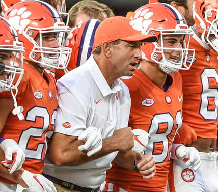 Clemson head coach Dabo Swinney is between his sons wide receiver Will Swinney(22), left, and wide receiver Drew Swinney(81) and the team for the Walk of Champions before Clemson and Georgia played in the Duke's Mayo Classic Sep 4, 2021; Charlotte, North Carolina, USA;  at Bank of America Stadium.

Ncaa Football Georgia At Clemson