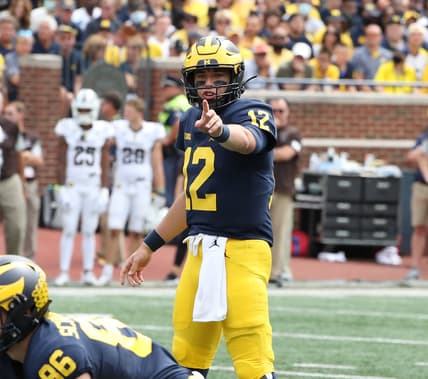 Michigan Wolverines quarterback Cade McNamara (12) signals at the line of scimmage during second half action against the Western Michigan Broncos Saturday, Sept. 4, 2021.

Mich West