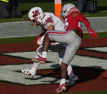Jan 1, 2022; Pasadena, California, USA; Utah Utes wide receiver Britain Covey (18) scores a touchdown past Ohio State Buckeyes cornerback Cameron Brown (26) during the  first quarter of the 2022 Rose Bowl at Rose Bowl. Mandatory Credit: Robert Hanashiro-USA TODAY Sports