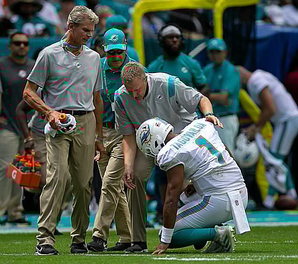 Miami Dolphins Miami Dolphins quarterback Tua Tagovailoa (1), falls to the ground as he ties to leave the field after being sacked by Buffalo Bills offensive tackle Daryl Williams (75) during first quarter action of their NFL game at Hard Rock Stadium Sunday in Miami Gardens. Tagovailoa did not return to action. BILL INGRAM/ Palm Beach PostDolphins V Bills 02