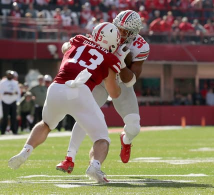 Ohio State Buckeyes running back TreVeyon Henderson (32) is tackled by Nebraska Cornhuskers linebacker JoJo Domann (13) during Saturday's NCAA Division I football game at Memorial Stadium in Lincoln, Neb., on November 6, 2021.

Osu21neb Bjp 531