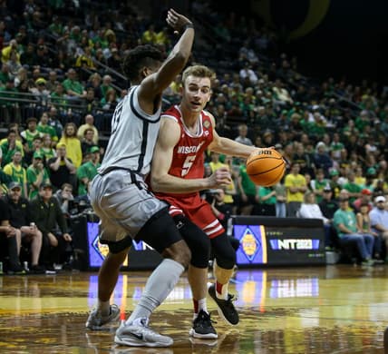 Wisconsin forward Tyler Wahl attempts to push past Oregon forward Quincy Guerrier as the Oregon Ducks host Wisconsin in the quarterfinal round of the NIT Tuesday, March 21, 2023 at Matthew Knight Arena in Eugene, Ore.

Ncaa Basketball Wisconsin At Oregon Mbb Nit Wisconsin At Oregon