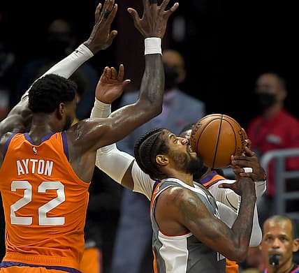 Jun 26, 2021; Los Angeles, California, USA; Los Angeles Clippers guard Paul George (13) drives to the basket against Phoenix Suns center Deandre Ayton (22) and forward Jae Crowder (99) in the first half of game four of the Western Conference Finals for the 2021 NBA Playoffs at Staples Center. Mandatory Credit: Jayne Kamin-Oncea-USA TODAY Sports