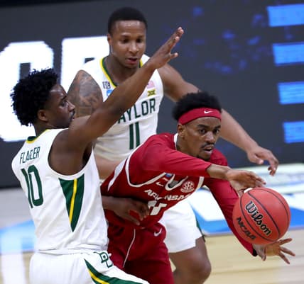 Arkansas Razorbacks guard Jalen Tate (11) moves the ball away from the defense of Baylor Bears guard Adam Flagler (10) and Baylor Bears guard Mark Vital (11) during the Elite Eight round of the 2021 NCAA Tournament on Monday, March 29, 2021, at Lucas Oil Stadium in Indianapolis, Ind. Mandatory Credit: Mykal McEldowney/IndyStar via USA TODAY Sports