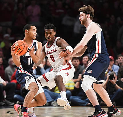 Dec 17, 2022; Birmingham, AL, USA; Alabama guard Jaden Bradley (0) tries to work through a screen by Gonzaga forward Drew Timme (2) as he guard Gonzaga guard Nolan Hickman (11) at Legacy Arena.

Ncaa Basketball Alabama Vs Gonzaga Cm Newton Classic