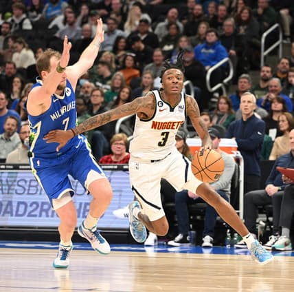Jan 25, 2023; Milwaukee, Wisconsin, USA; Denver Nuggets guard Bones Hyland (3) drives to the basket against Milwaukee Bucks guard Joe Ingles (7) in the second half at Fiserv Forum. Mandatory Credit: Michael McLoone-USA TODAY Sports